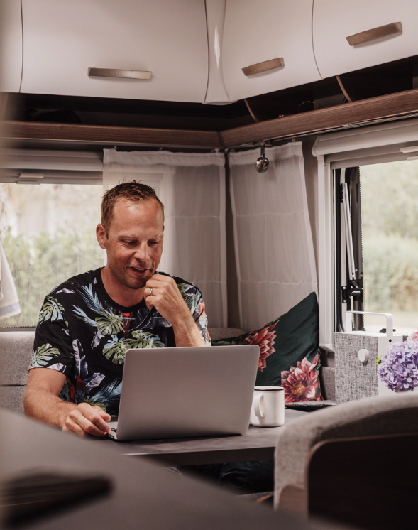 Man in a caravan looking at our website