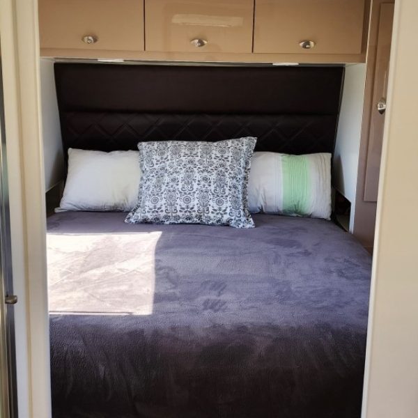 17-Queen-Size-bed-at-towing-end-of-Caravan-view-through-ensuite.jpg